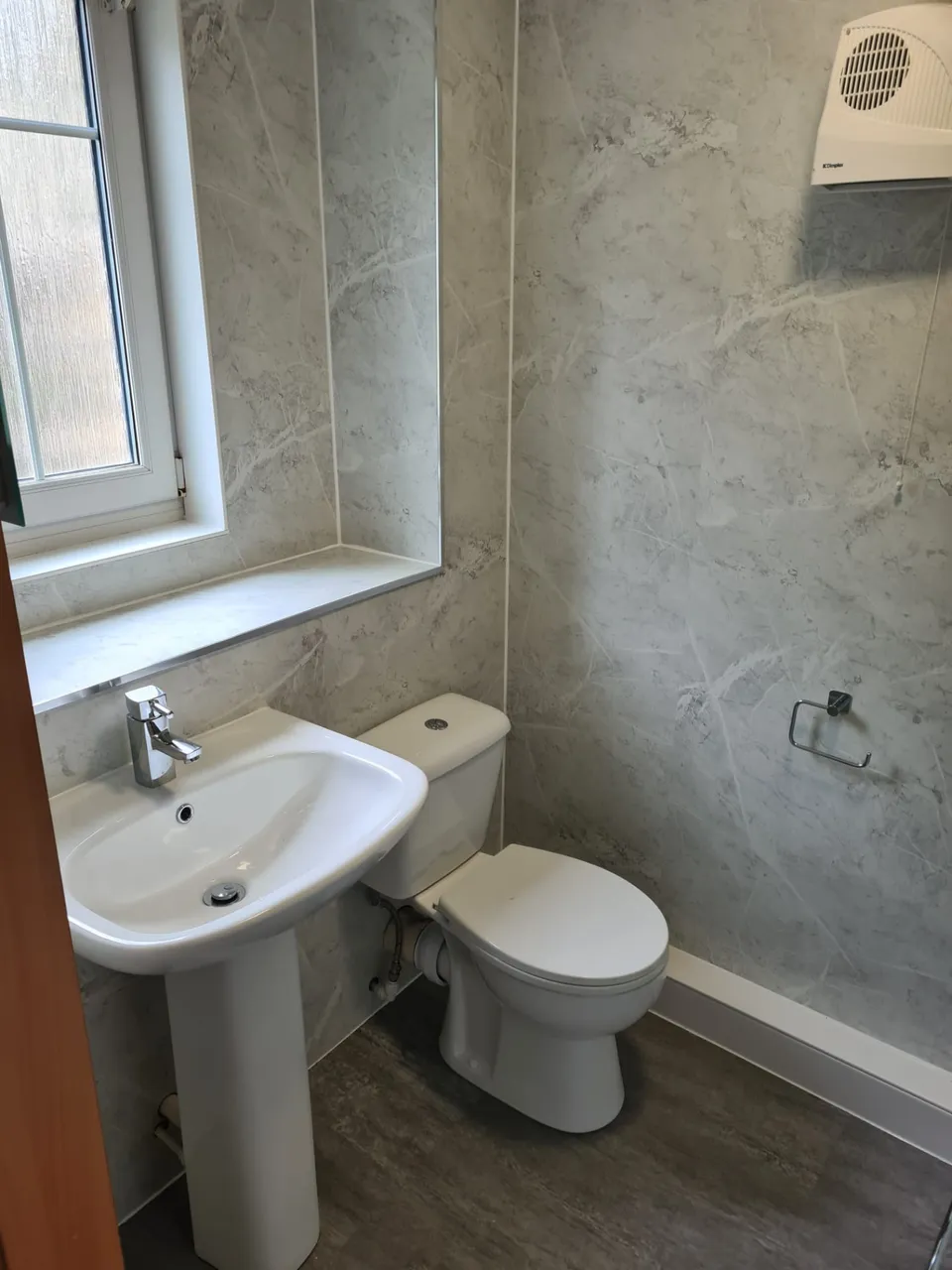 General Plumbing & Repairs in Kirkcaldy and Fife: Grey marble-effect panelled bathroom with pedestal basin and close-coupled toilet
